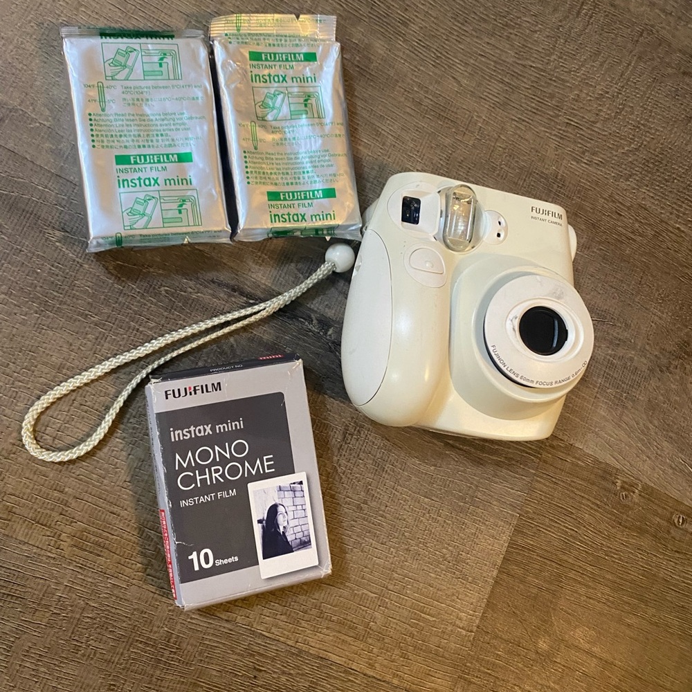 Polaroid camera/ white/ and Film
